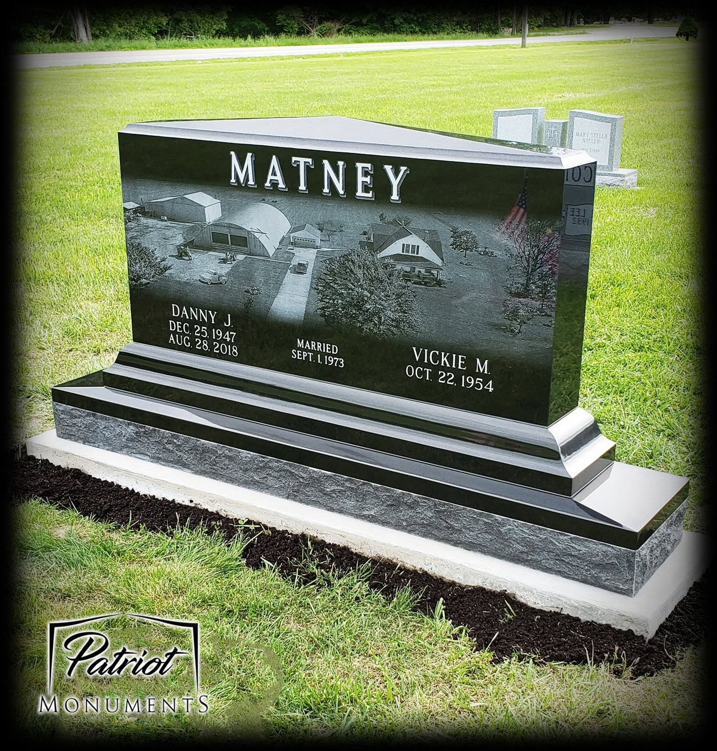 Matney black granite companion monument with laser-etched farm scene engraving
