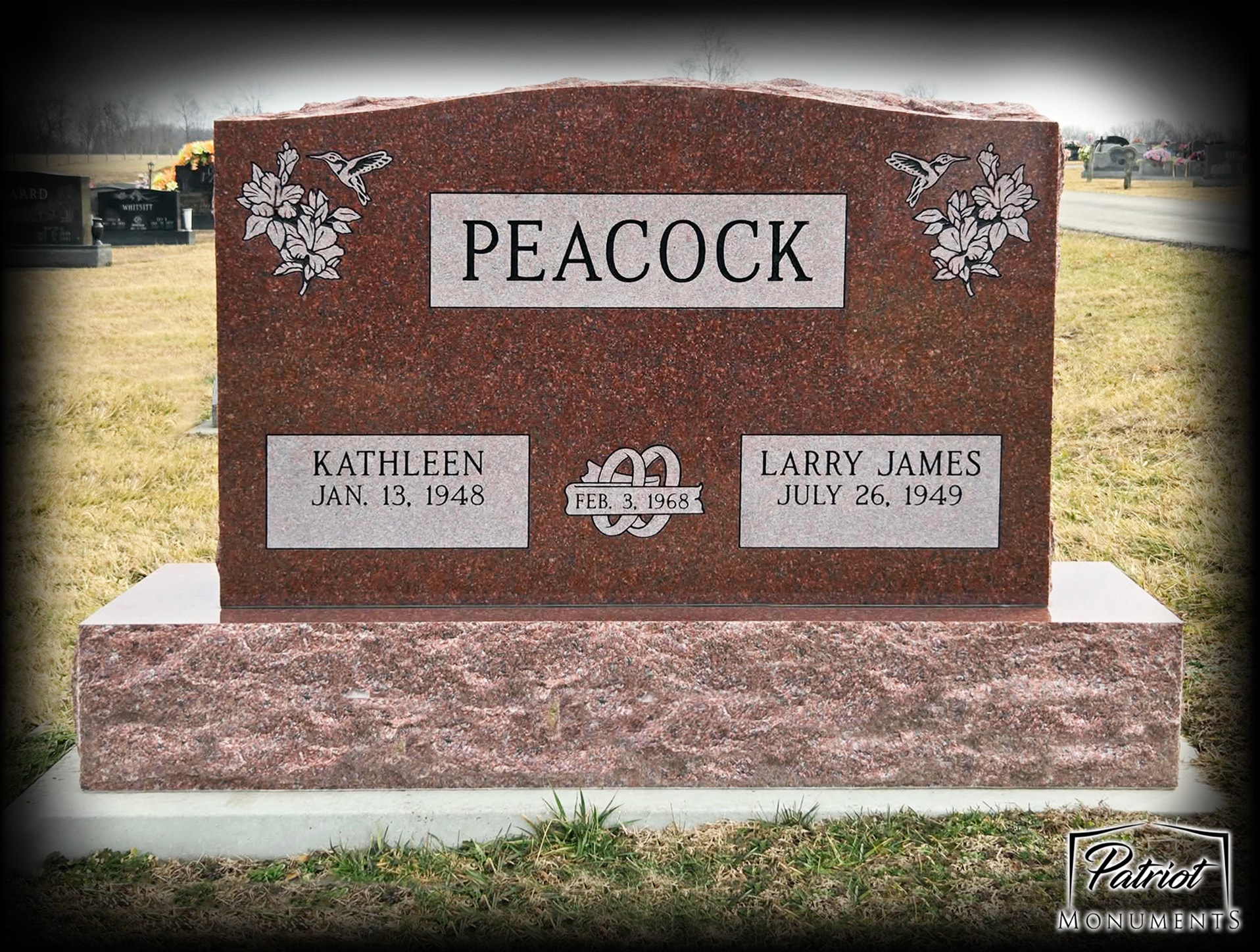Peacock family red granite monument with hummingbird and floral engravings