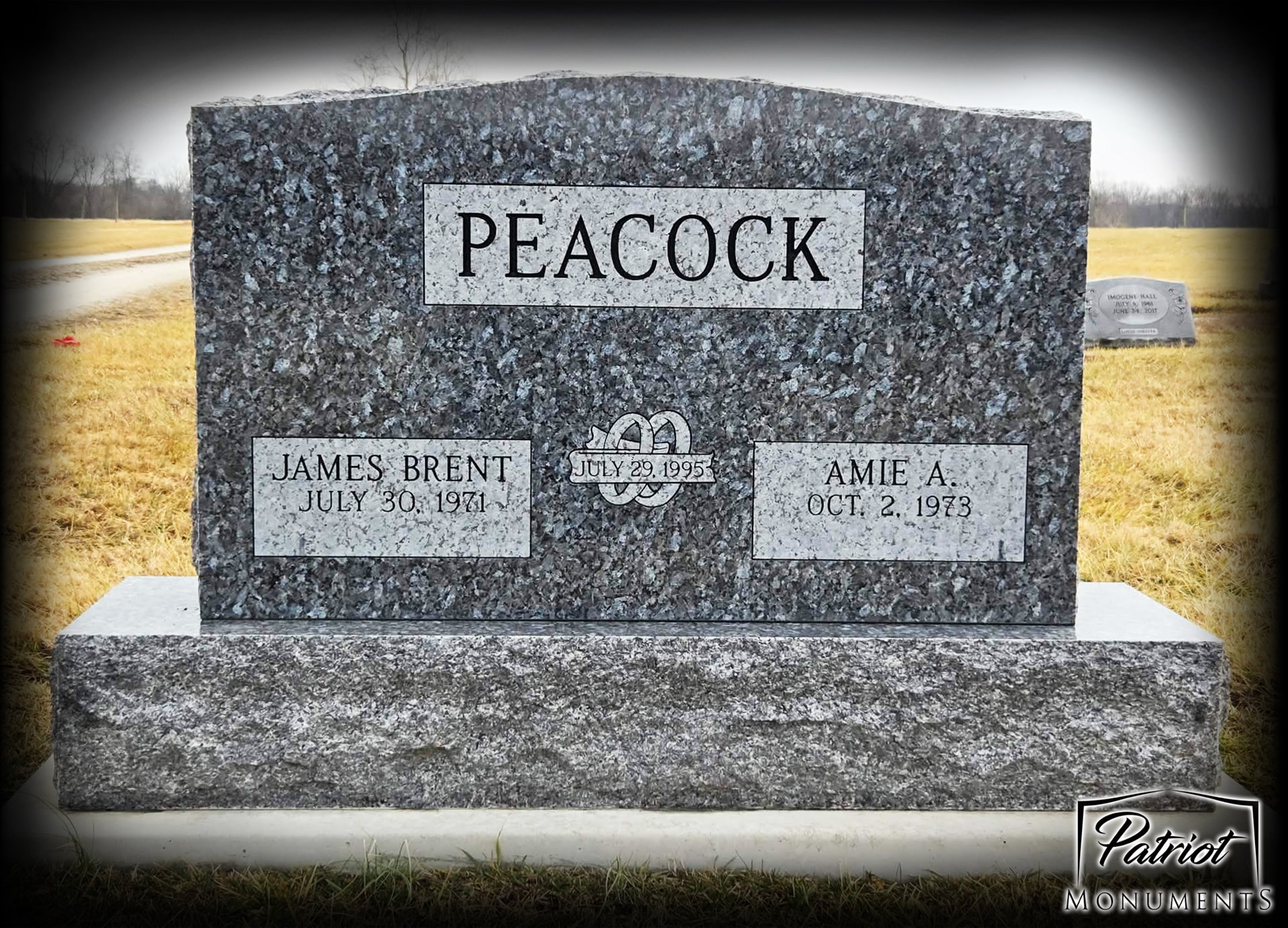 Peacock James Brent and Amie A. blue granite companion monument